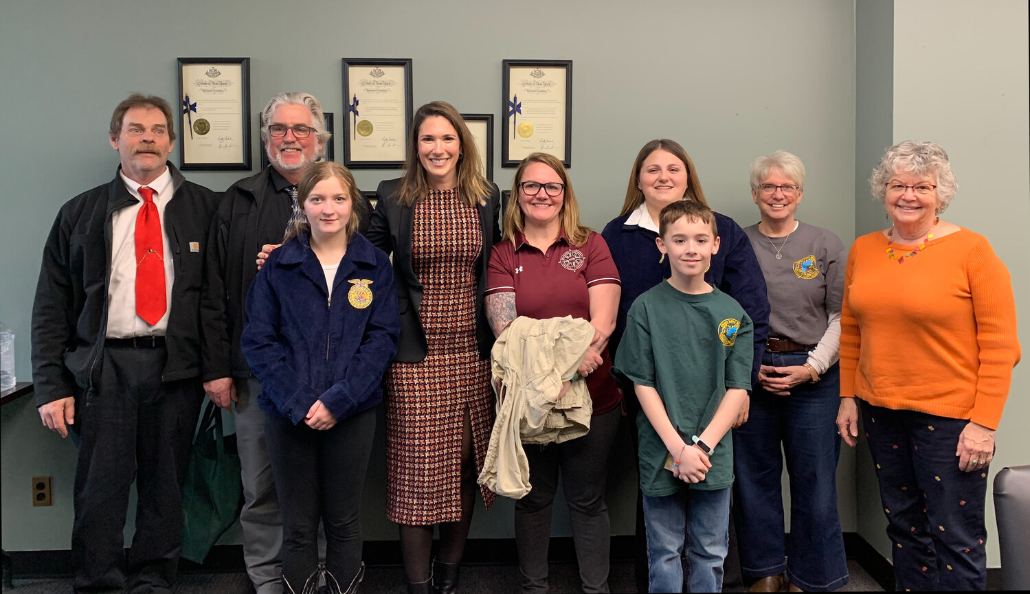 Morgan Williams and Alexes Sousa are pictured with New York State Senator Michelle Hinchey, FFA advisor Amanda Larsen, NYS Maple Producers Association Executive Director Helen Thomas, and other New York maple producers.